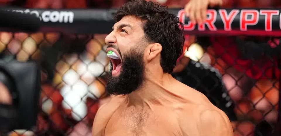Fighter celebrating inside the octagon after match