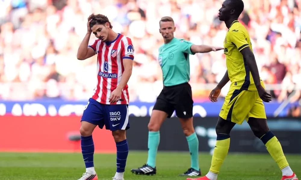 Atletico Madrid player reacts after referee's decision