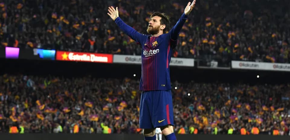 Player celebrating in front of cheering crowd