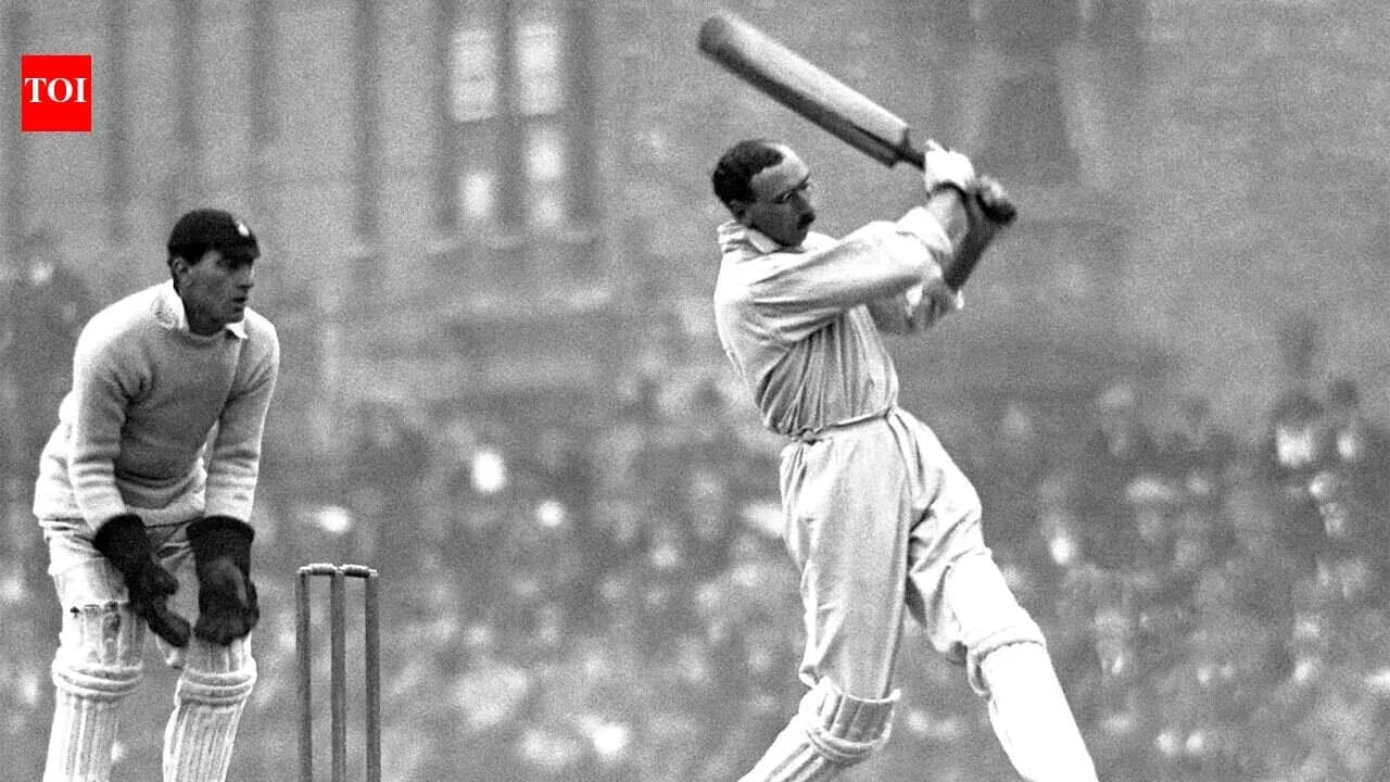 Batsman playing a shot with wicketkeeper behind