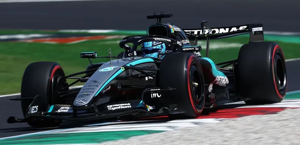 Mercedes Formula 1 car navigating a racetrack corner