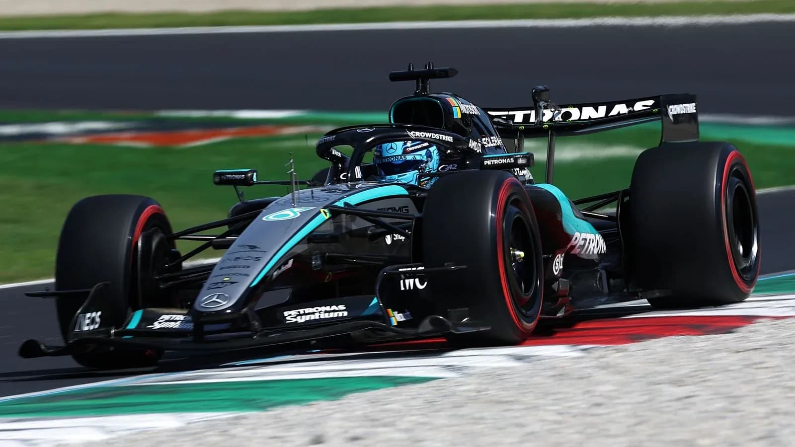 Mercedes Formula 1 car navigating a racetrack corner Mercedes Formula 1 car navigating a racetrack corner