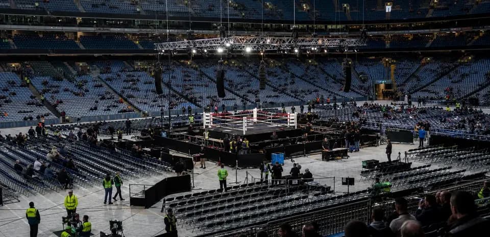 Boxing ring setup in empty stadium before event