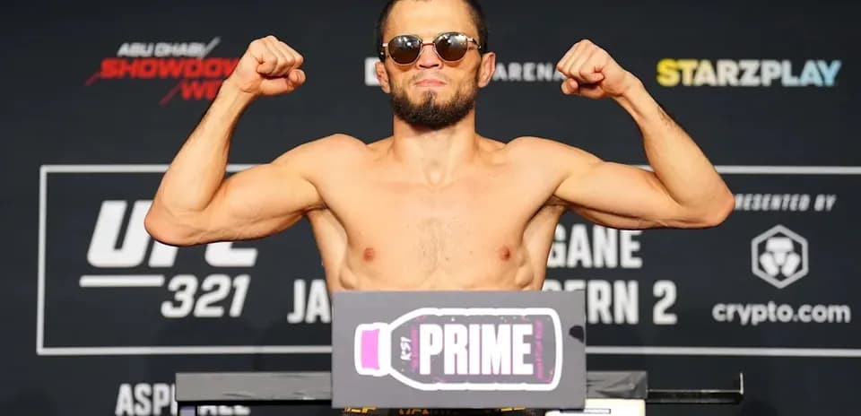 Fighter posing on scale at UFC 321 weigh-in