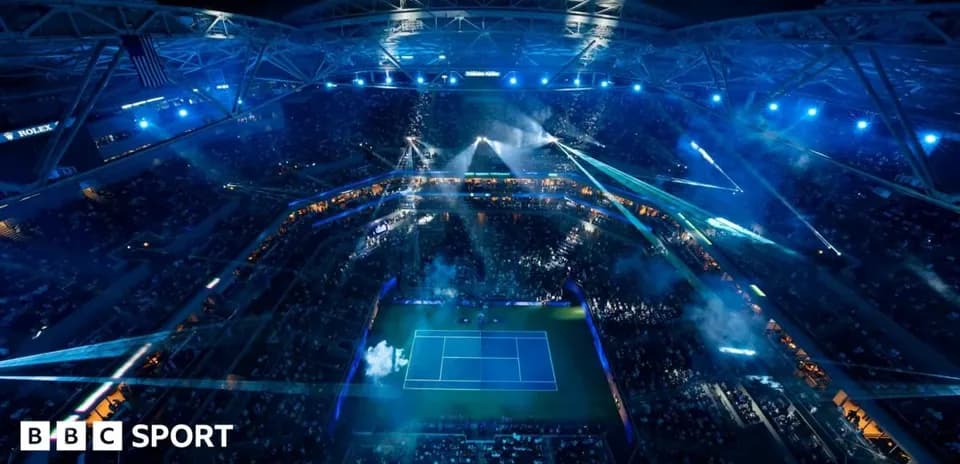 Aerial view of a tennis match at night