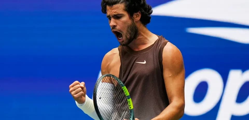 Tennis player celebrating a point during match