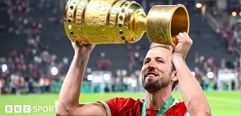 Player celebrating with trophy after match victory