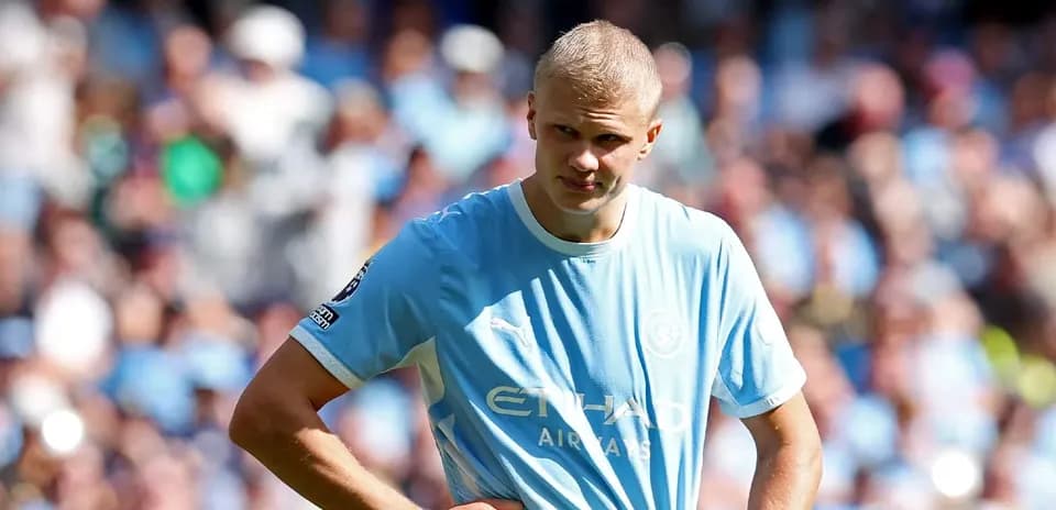 Player in light blue jersey on the pitch