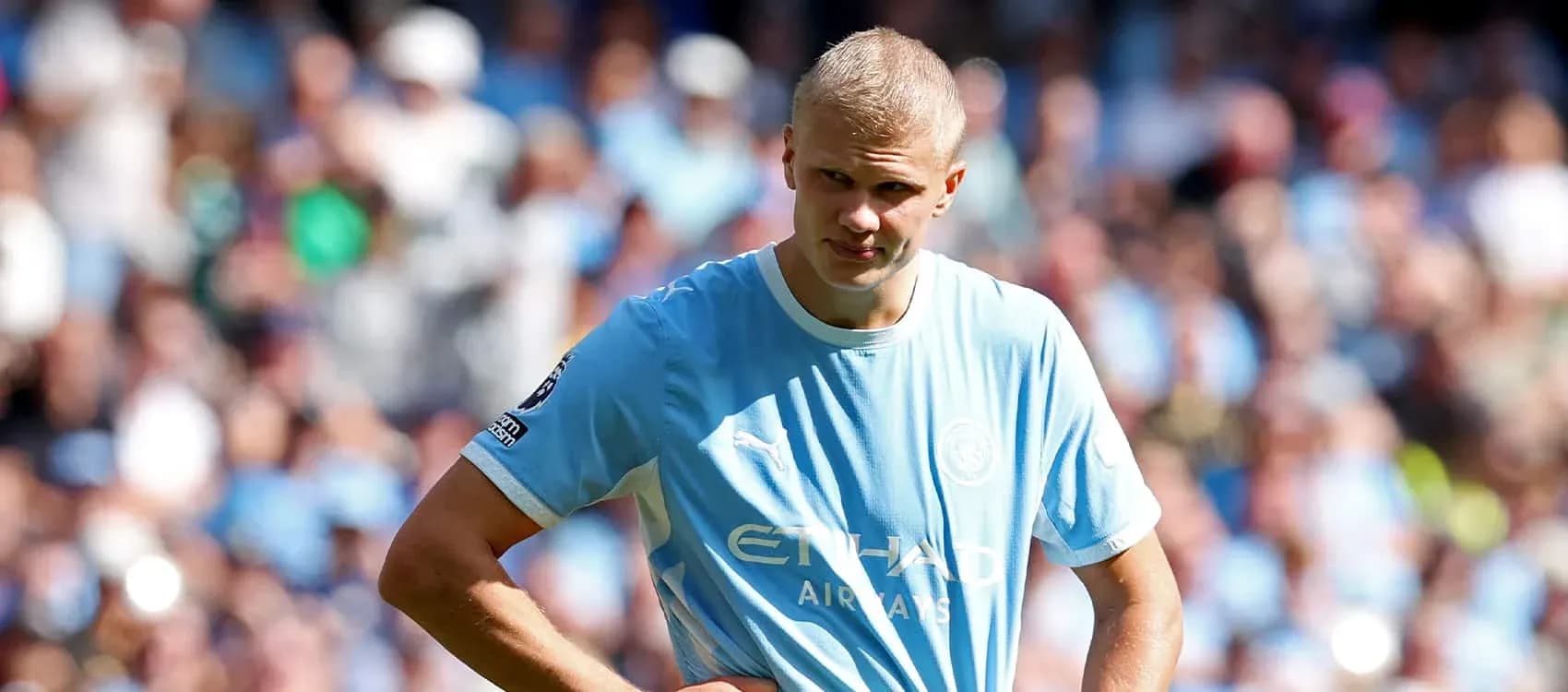 Player in light blue jersey on the pitch