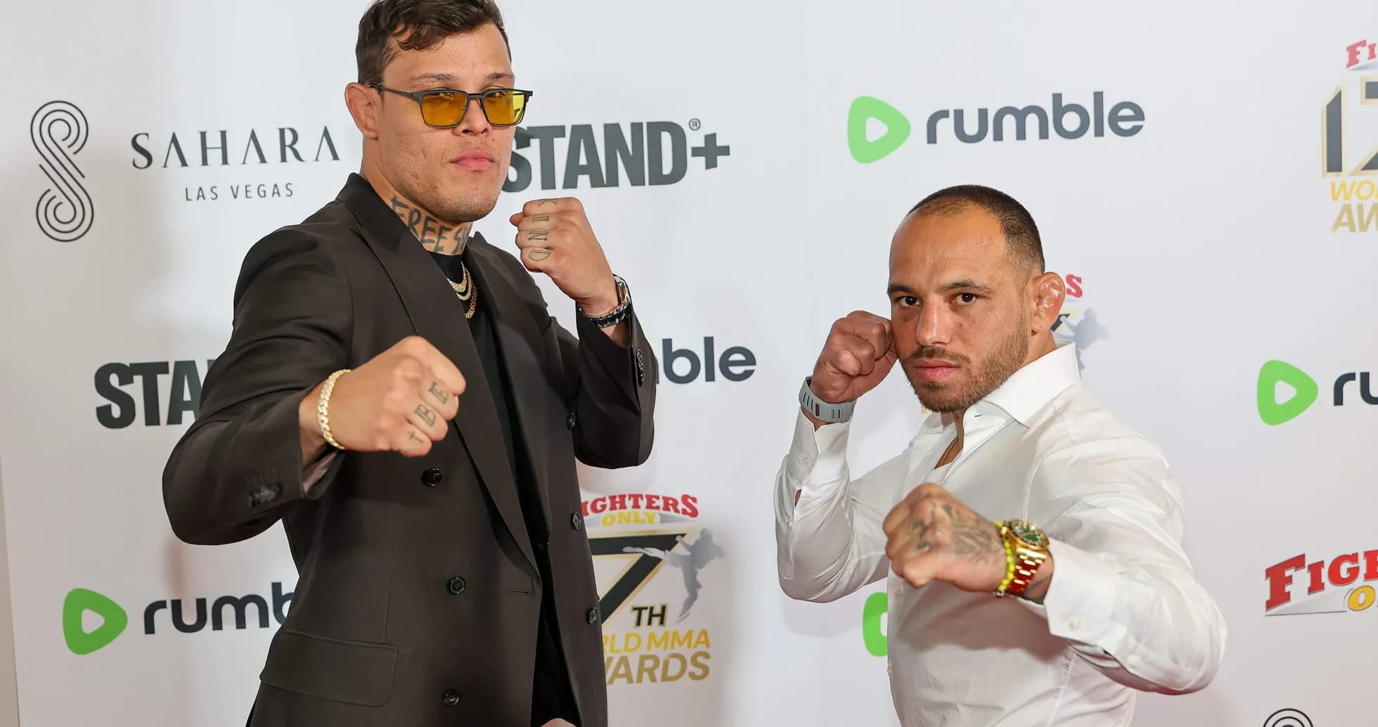 Two fighters posing at MMA awards event