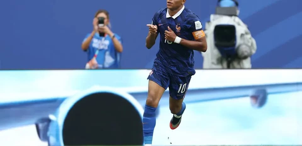 Player celebrating goal in France kit during match