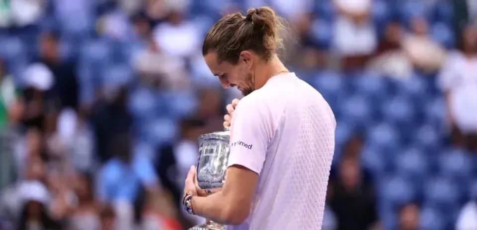 Player holding trophy after winning tournament