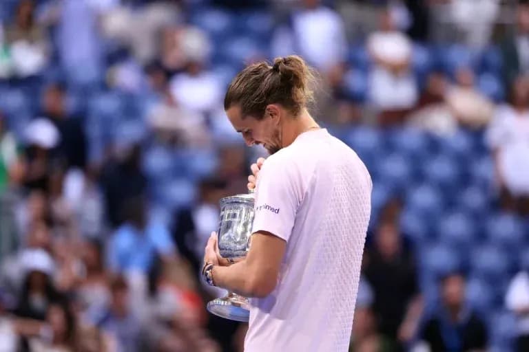 Player holding trophy after winning tournament