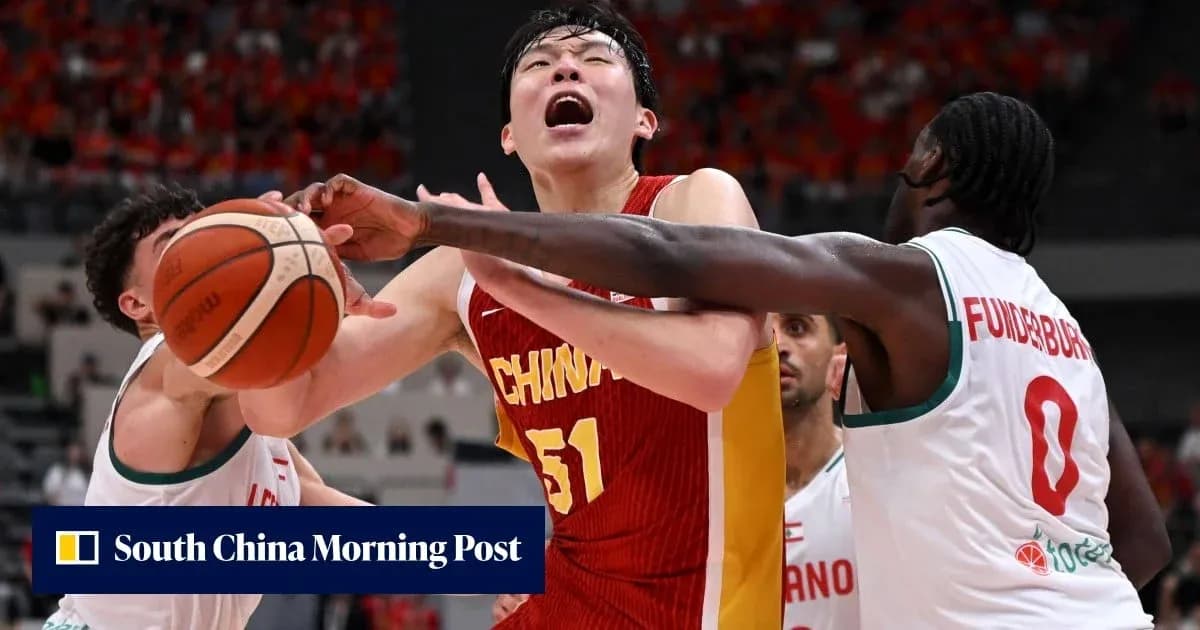 Chinese player contested by two defenders during game Chinese player contested by two defenders during game