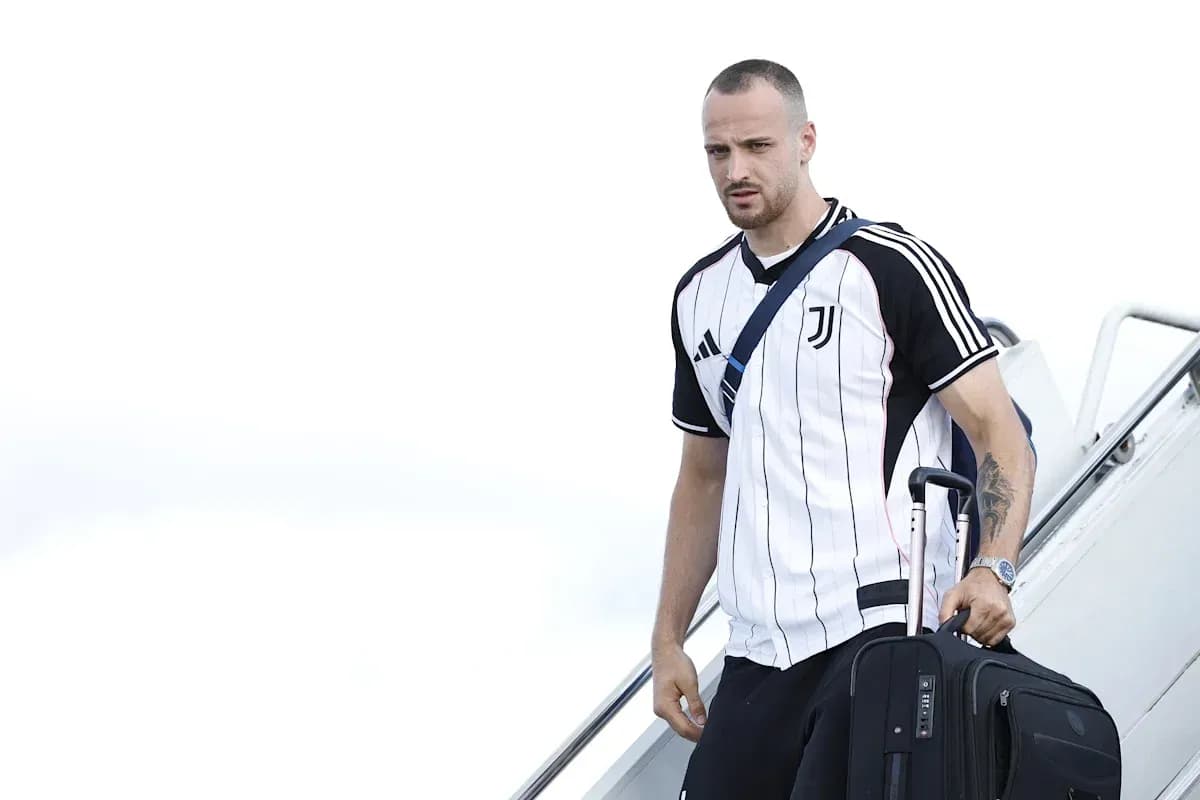 Player arriving with suitcase at airport terminal