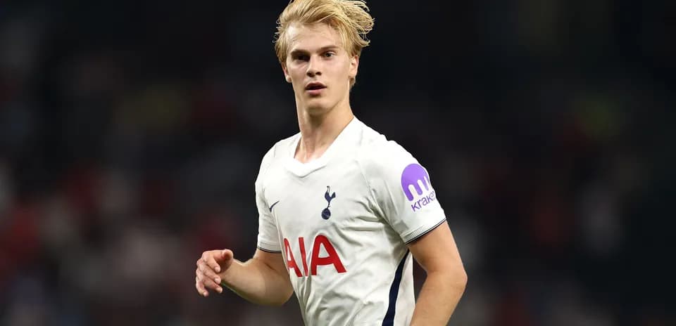Player wearing Tottenham jersey during match action