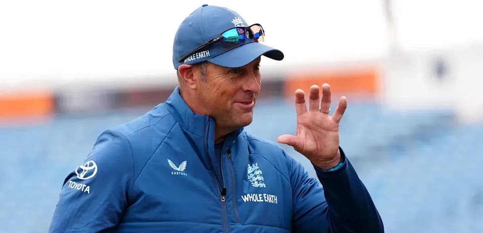 Cricket coach gesturing during training session