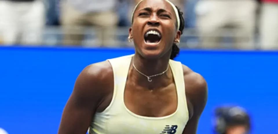 Tennis player celebrating after winning a point