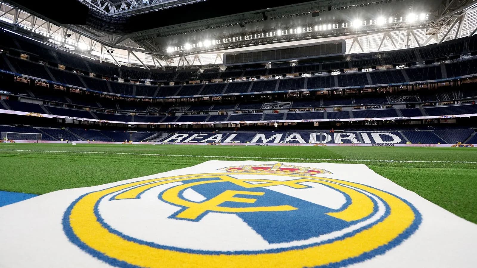 Real Madrid logo on the pitch at stadium