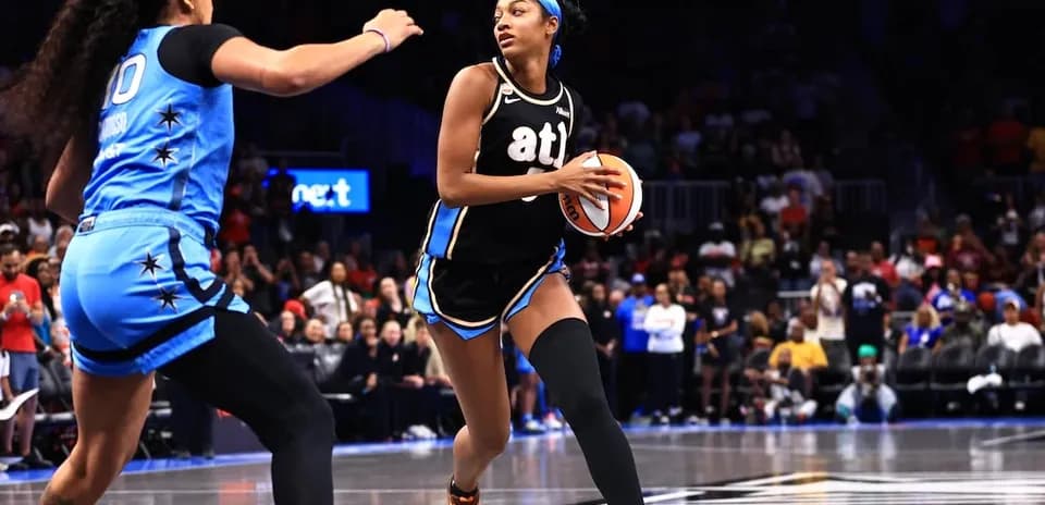Player dribbling basketball during competitive game