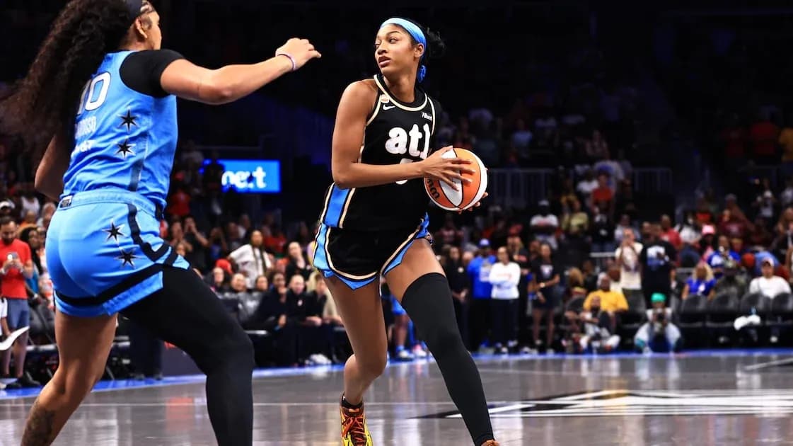Player dribbling basketball during competitive game