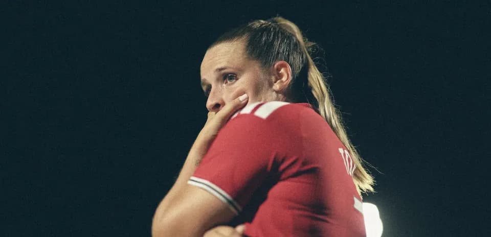 Player in red jersey during night match