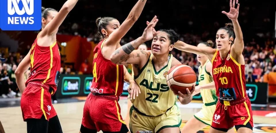 Player shooting during basketball match between Australia and Spain