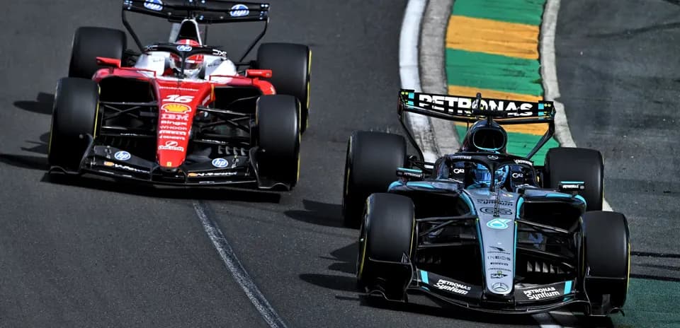 Two Formula 1 cars racing on the track