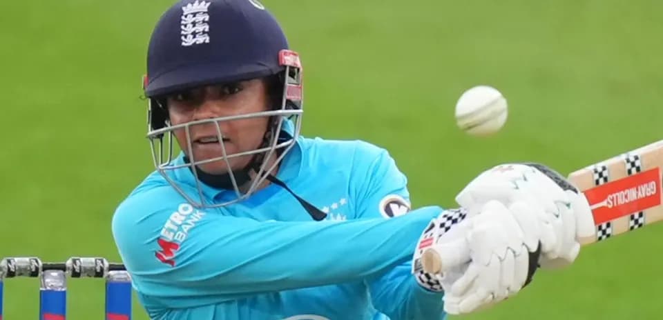 Batter hitting a cricket ball during match