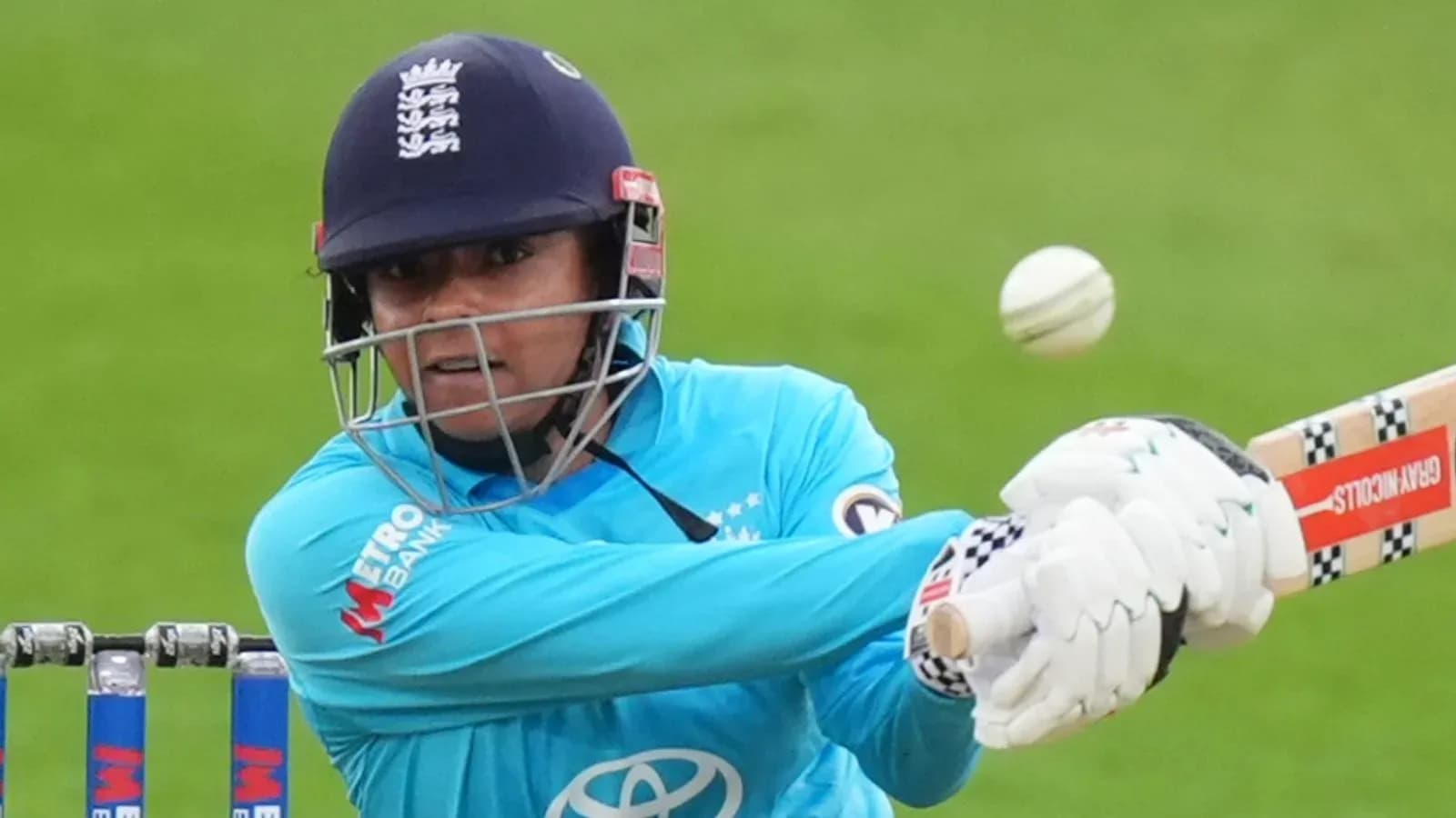 Batter hitting a cricket ball during match