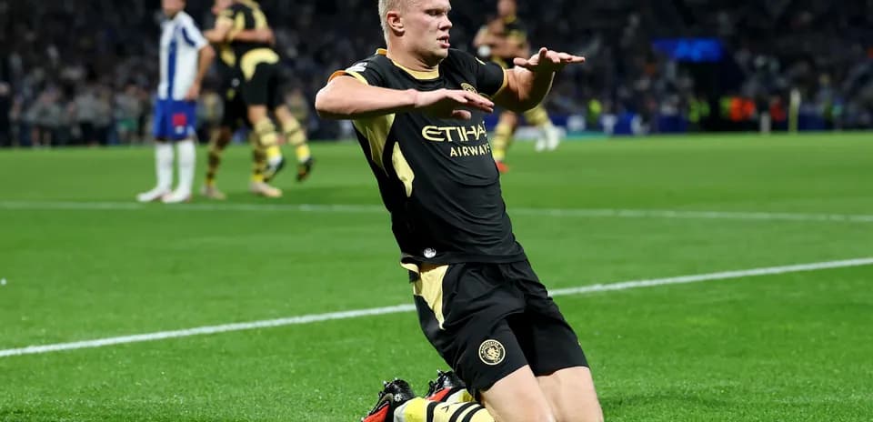 Player celebrating on the pitch after scoring goal