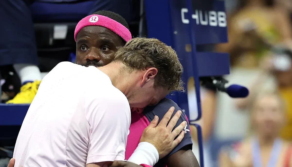 Two players embracing during a tennis match Two players embracing during a tennis match