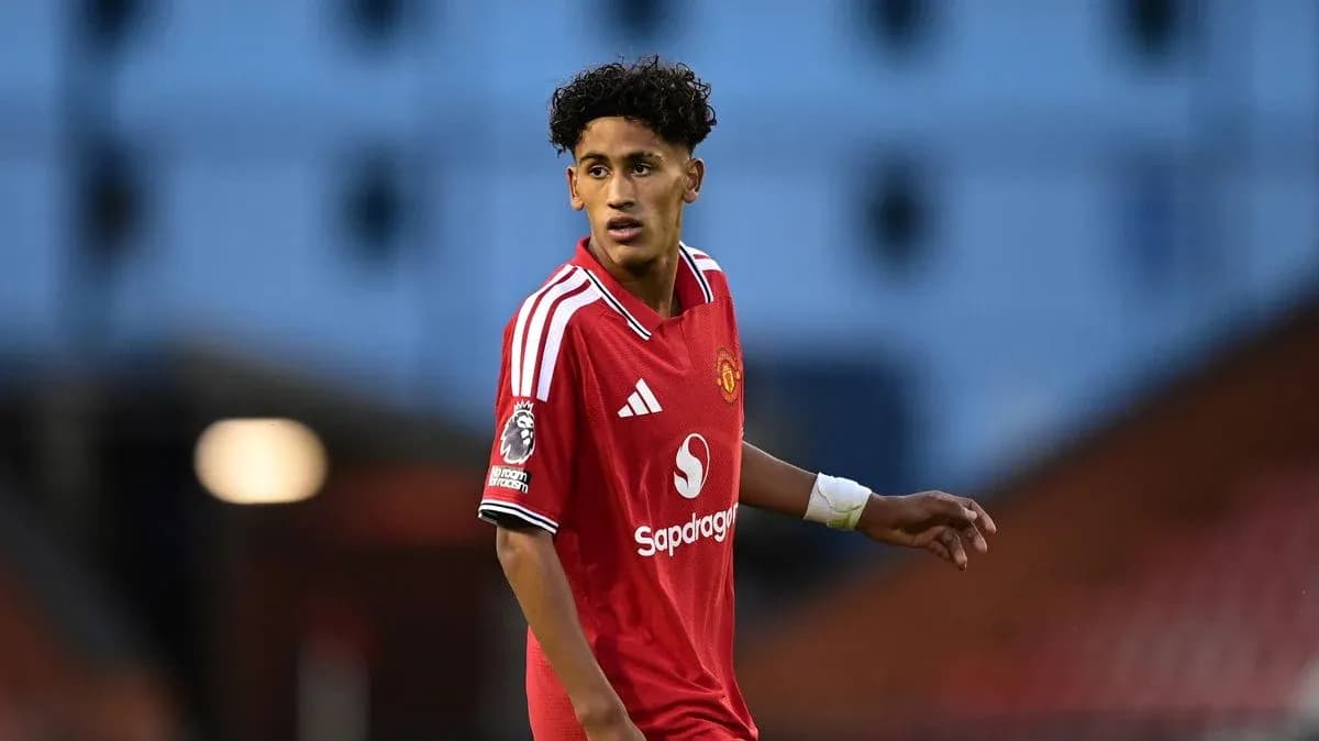 Player in Manchester United jersey on the field Player in Manchester United jersey on the field