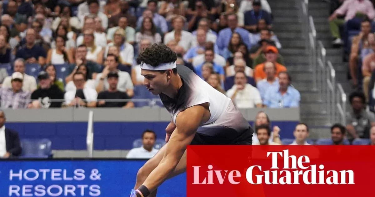 Tennis player serving during a match with spectators Tennis player serving during a match with spectators