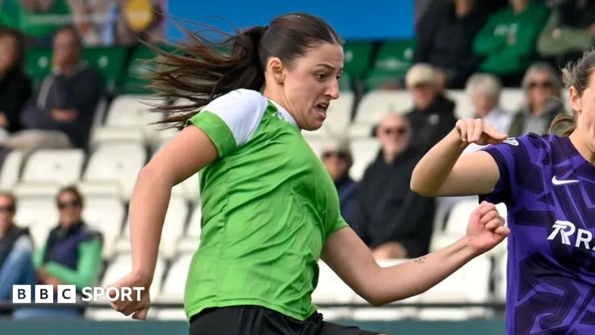Player in green sprinting during a football match Player in green sprinting during a football match