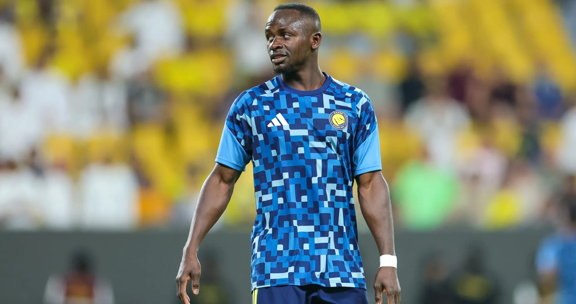 Player in blue patterned jersey during warm-up Player in blue patterned jersey during warm-up