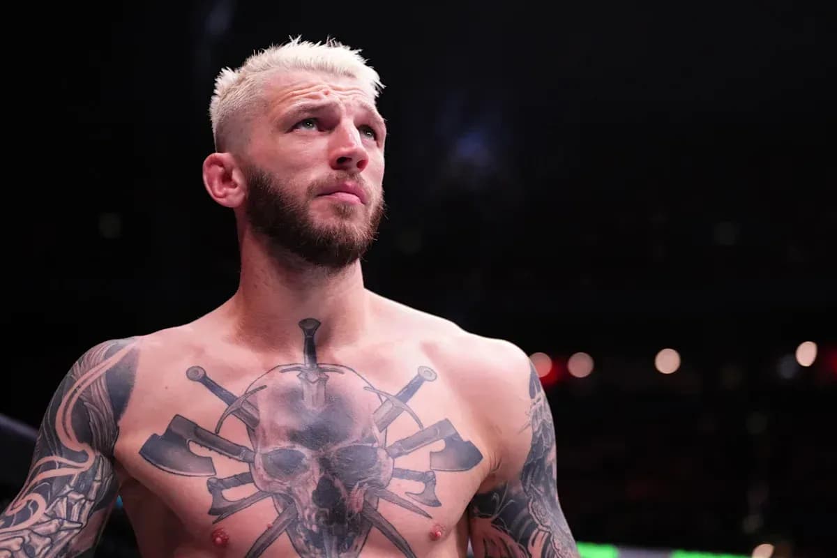 Bare-chested fighter with tattoos in ring Bare-chested fighter with tattoos in ring