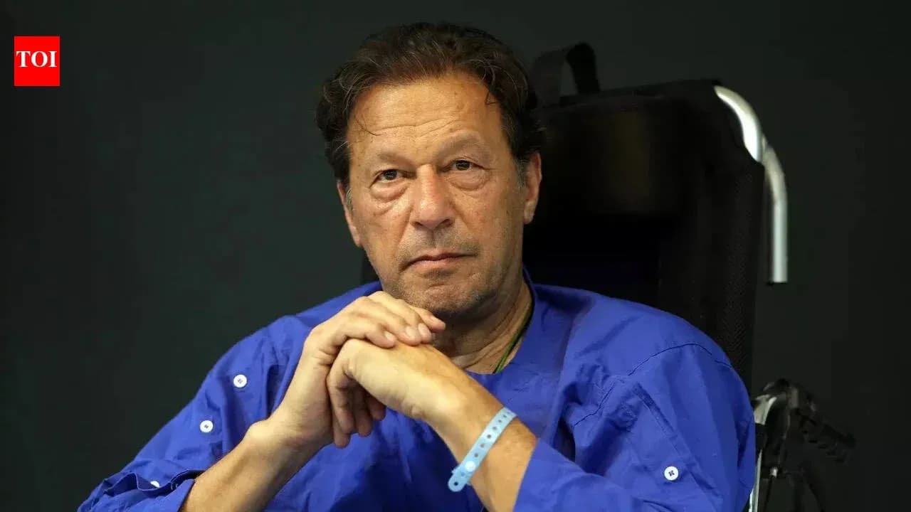 Man in wheelchair wearing blue shirt with serious expression Man in wheelchair wearing blue shirt with serious expression