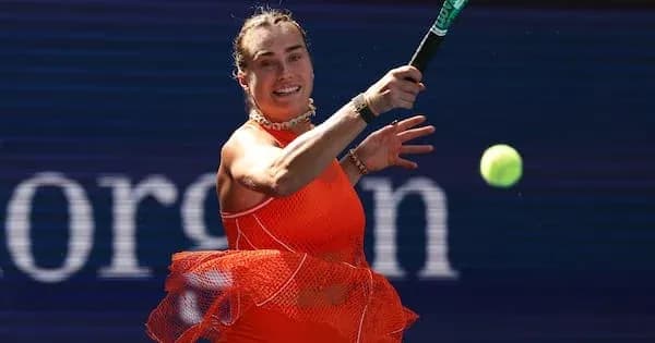 Player hitting a tennis ball during a match Player hitting a tennis ball during a match