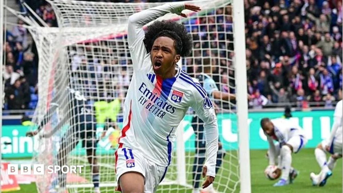 Player celebrating after scoring a goal for Lyon Player celebrating after scoring a goal for Lyon