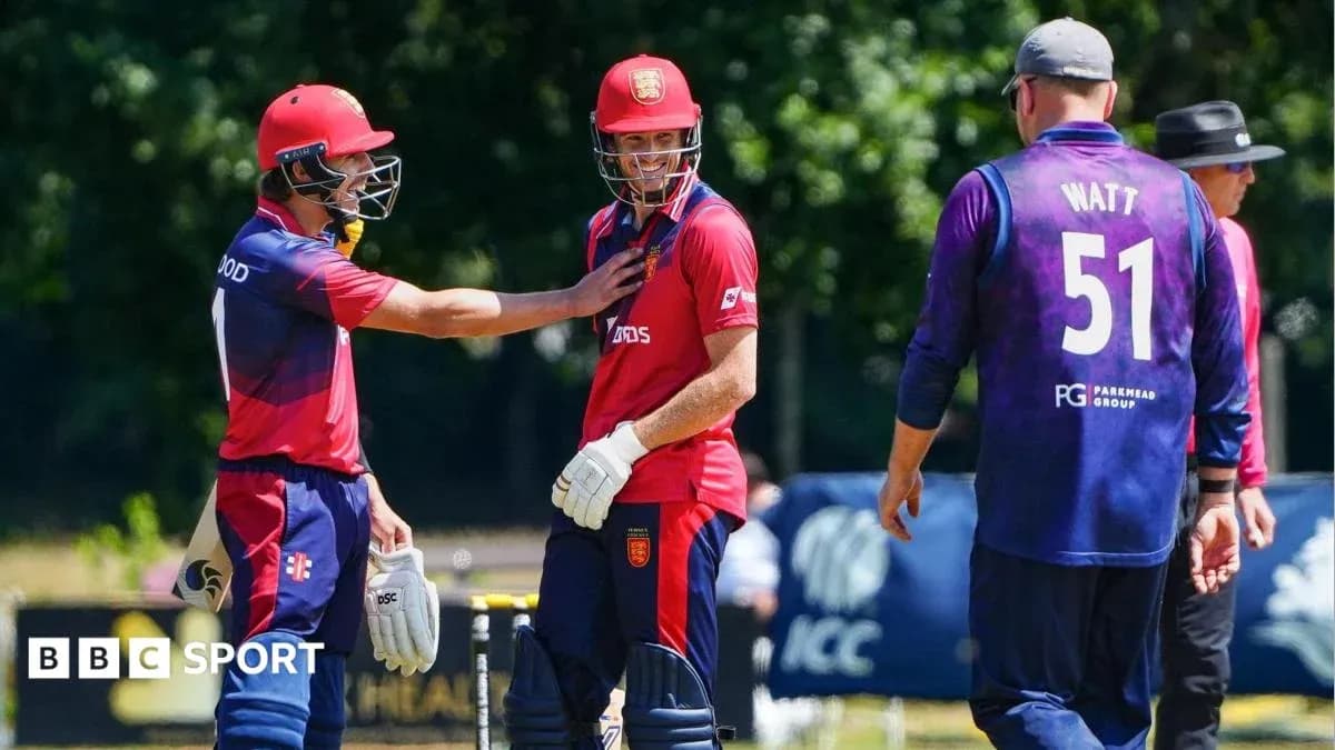 Players discussing on cricket field during match Players discussing on cricket field during match