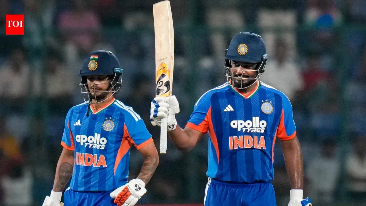 Two Indian cricketers celebrating after scoring runs Two Indian cricketers celebrating after scoring runs