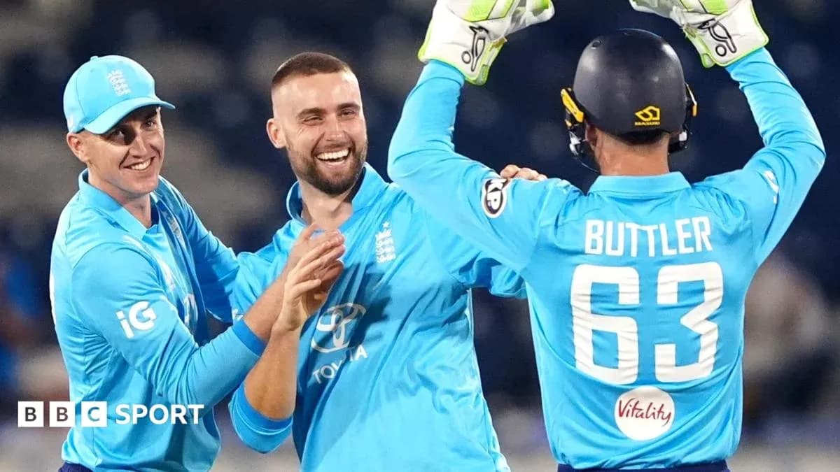 England cricket players celebrating a wicket together England cricket players celebrating a wicket together