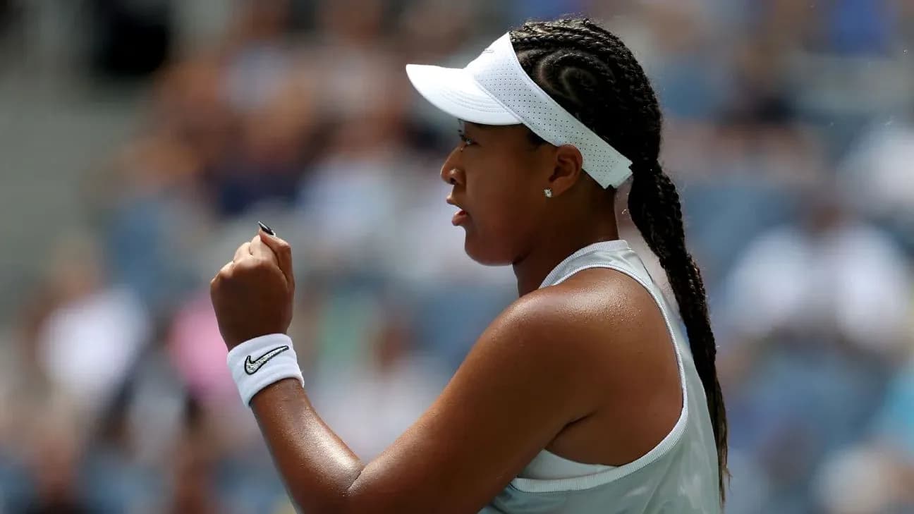 Tennis player celebrating with a raised fist Tennis player celebrating with a raised fist