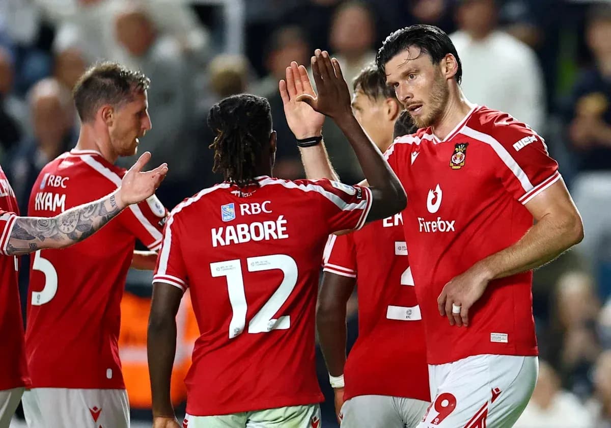Players celebrating together after scoring a goal Players celebrating together after scoring a goal