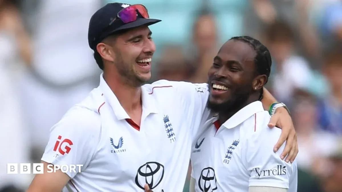 Two cricketers celebrating together on the field Two cricketers celebrating together on the field