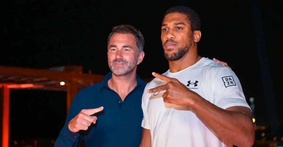 Two men posing together at an event Two men posing together at an event