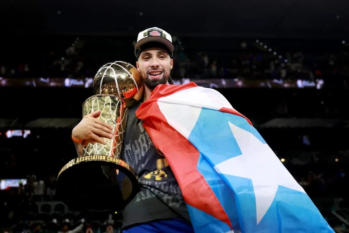 Player celebrating with trophy and flag after championship Player celebrating with trophy and flag after championship