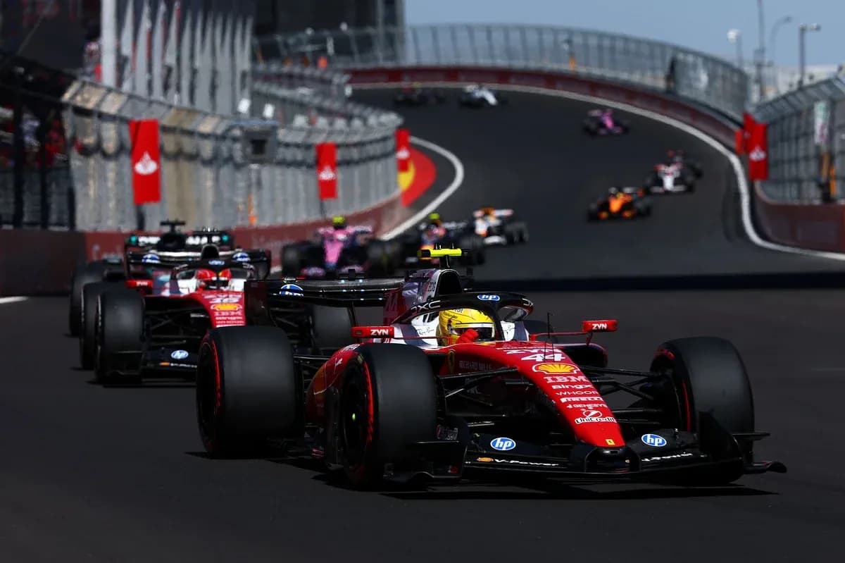 Ferrari car leading Formula 1 race on track Ferrari car leading Formula 1 race on track