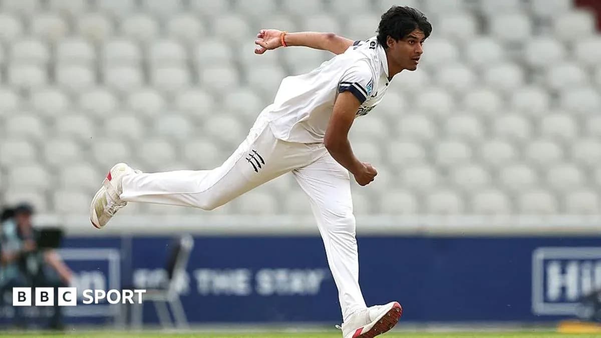 Cricketer bowling during a match at the stadium Cricketer bowling during a match at the stadium